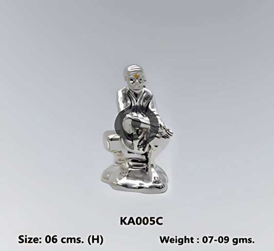 silver sculpture of Sai Baba